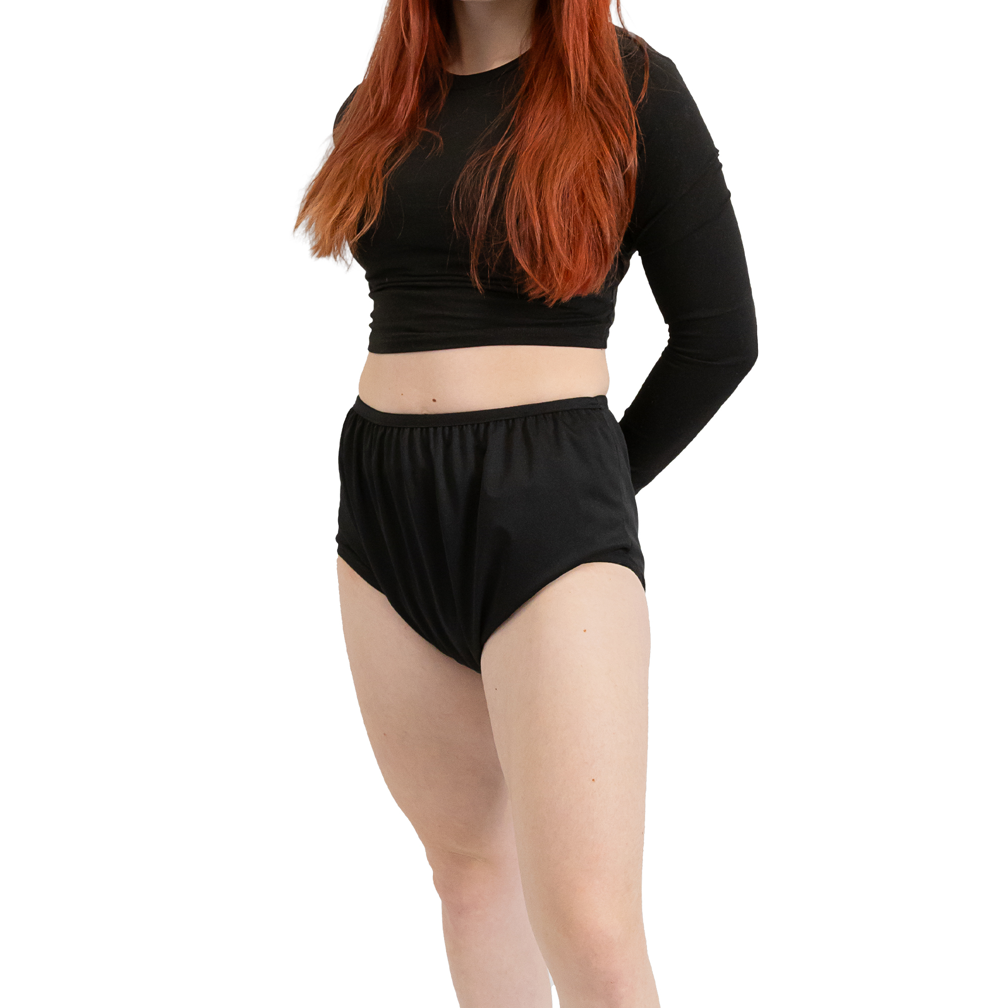 model wearing black shirt and black silence pants adult diaper cover with hands behind her back.